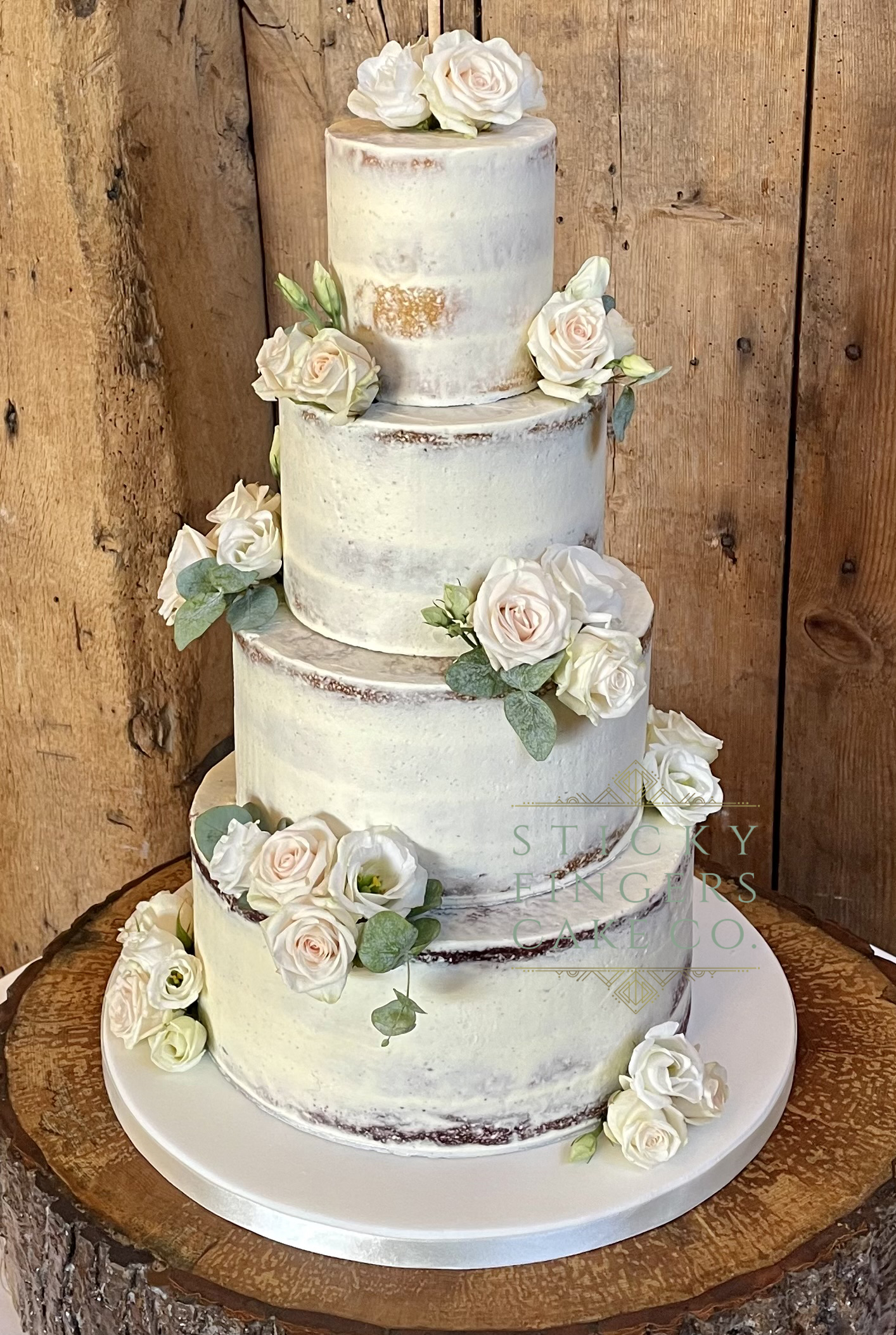 4-tier Semi Naked Wedding Cake displayed at Blake Hall, Ongar