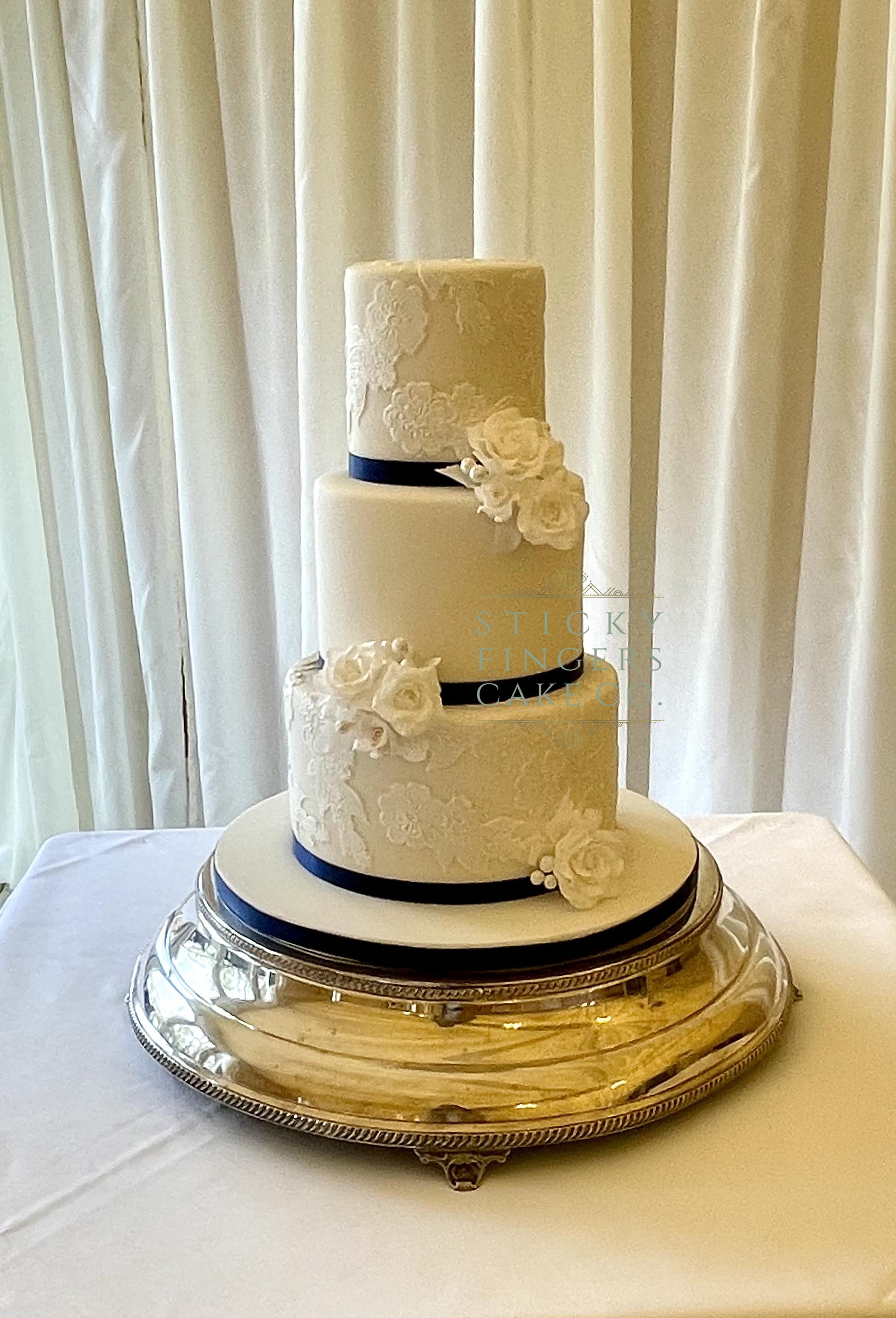 3-Tier Iced Wedding Cake displayed at Mulberry House, Ongar