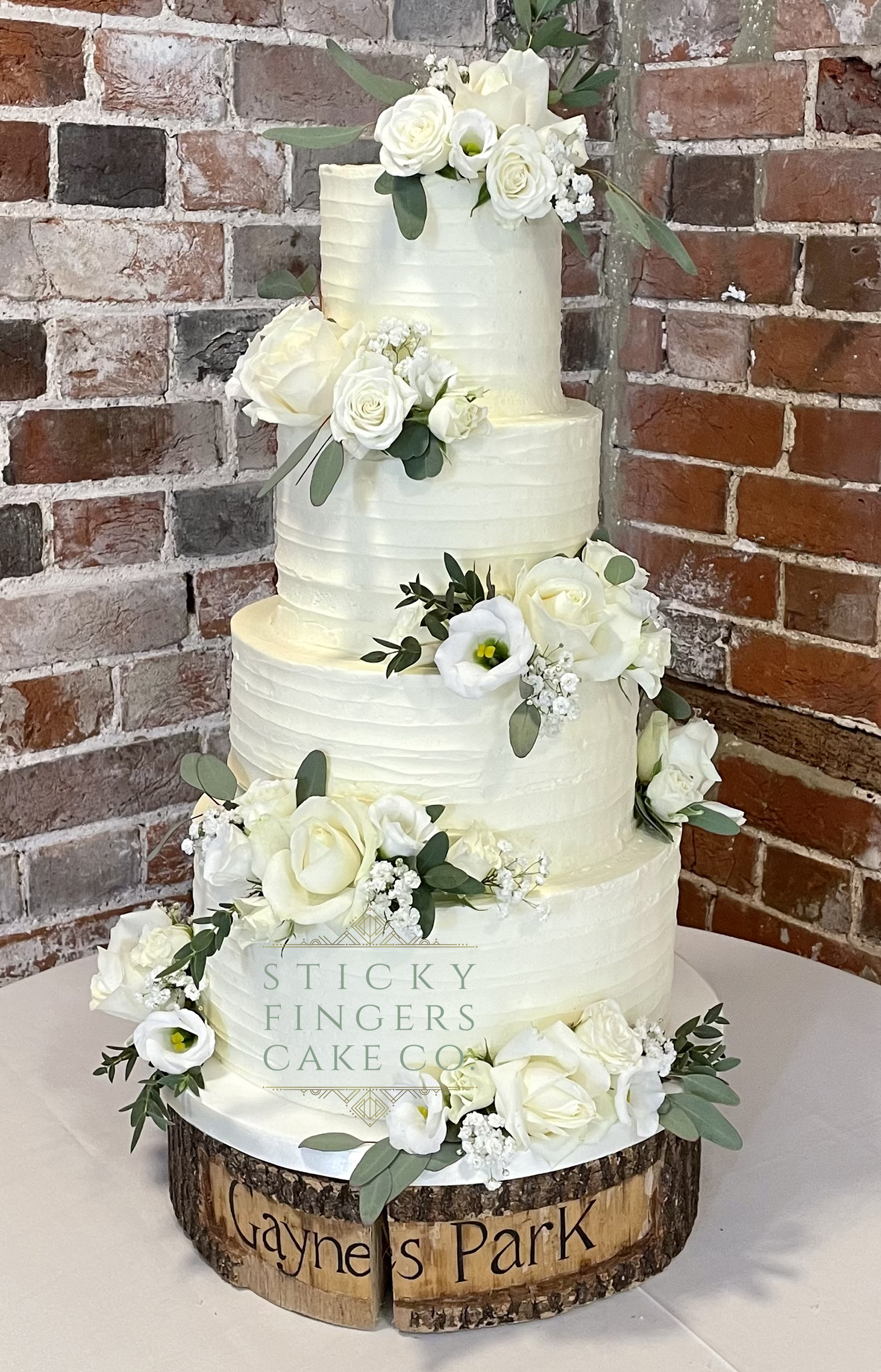 4-tier Buttercream Wedding Cake displayed at Gaynes Park, Epping