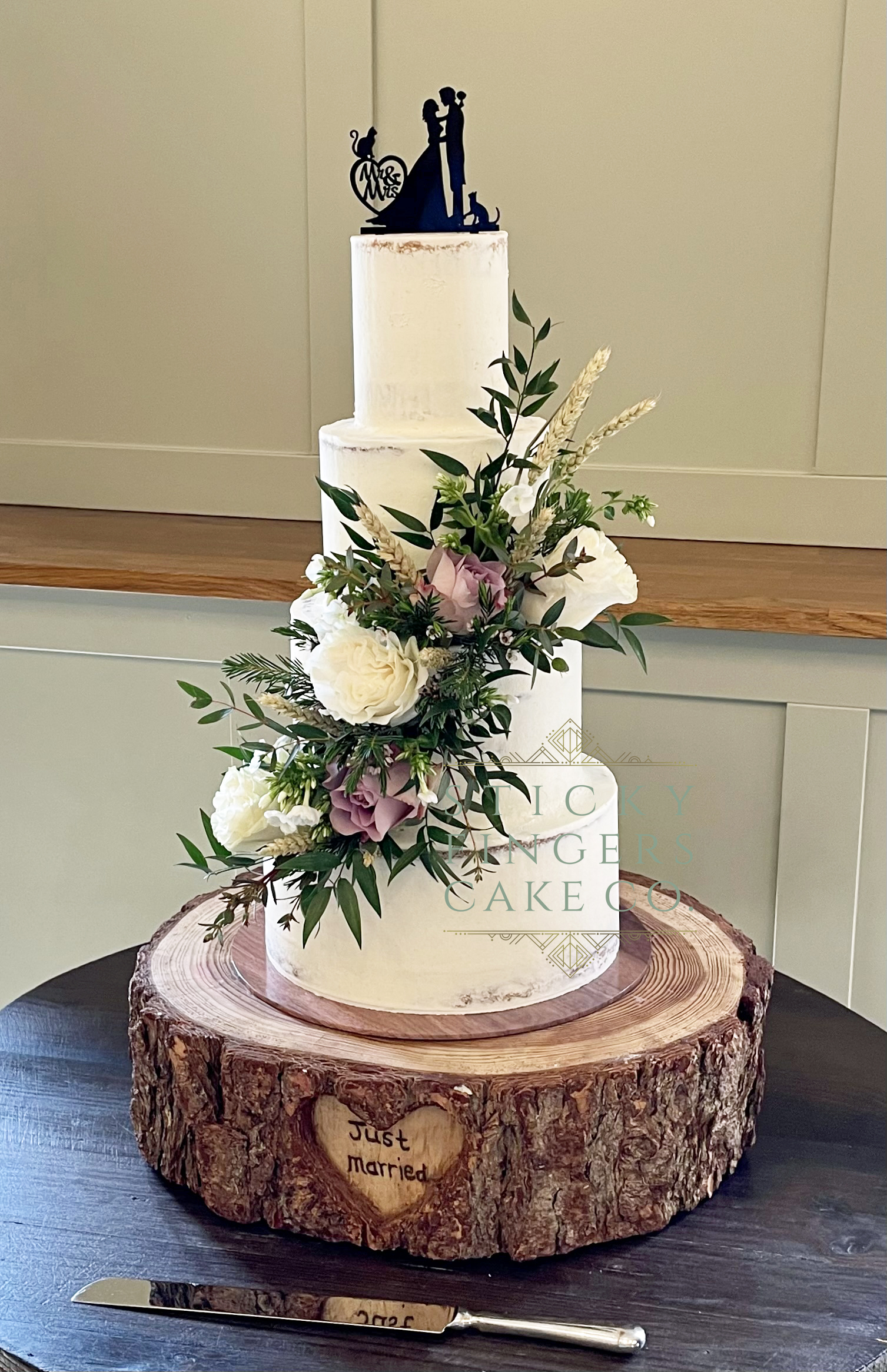 4-Tier Semi Naked Wedding Cake displayed at Apton Hall, Rochford